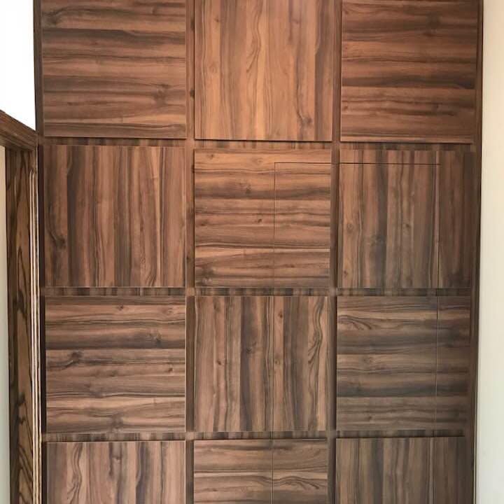 Walnut wall panelling — Panelling set out in a staggered block pattern.