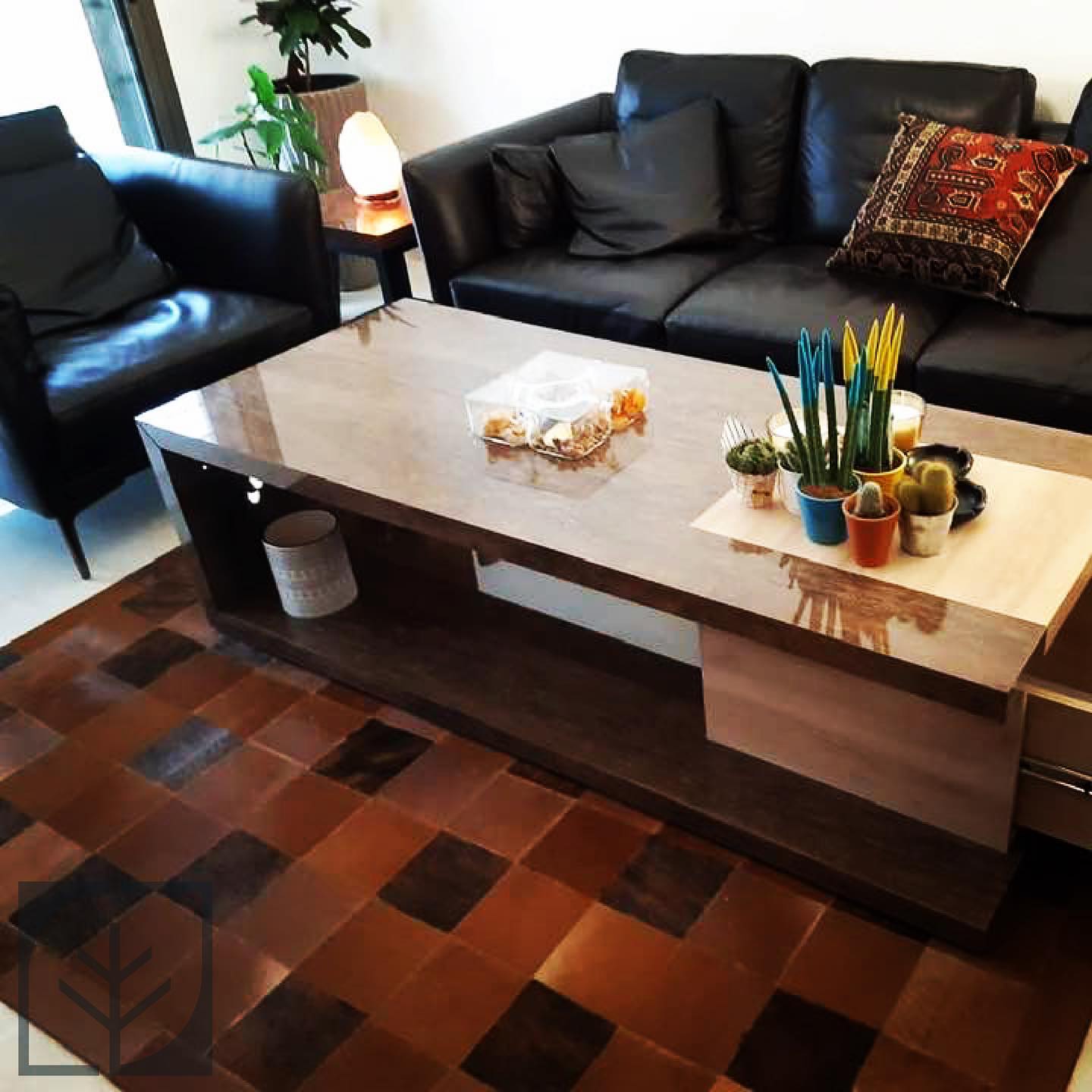 Table and parquet floor — A solid table above a multi-tone parquet floor.